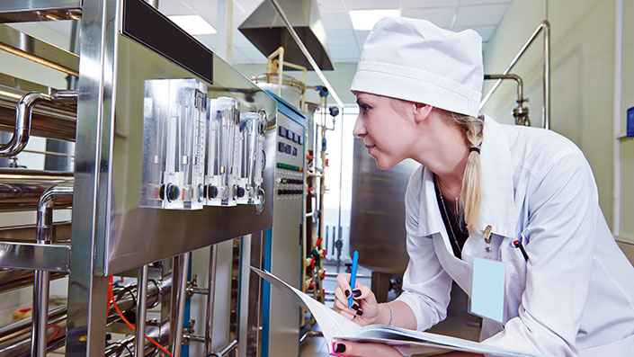 food worker checking equipment