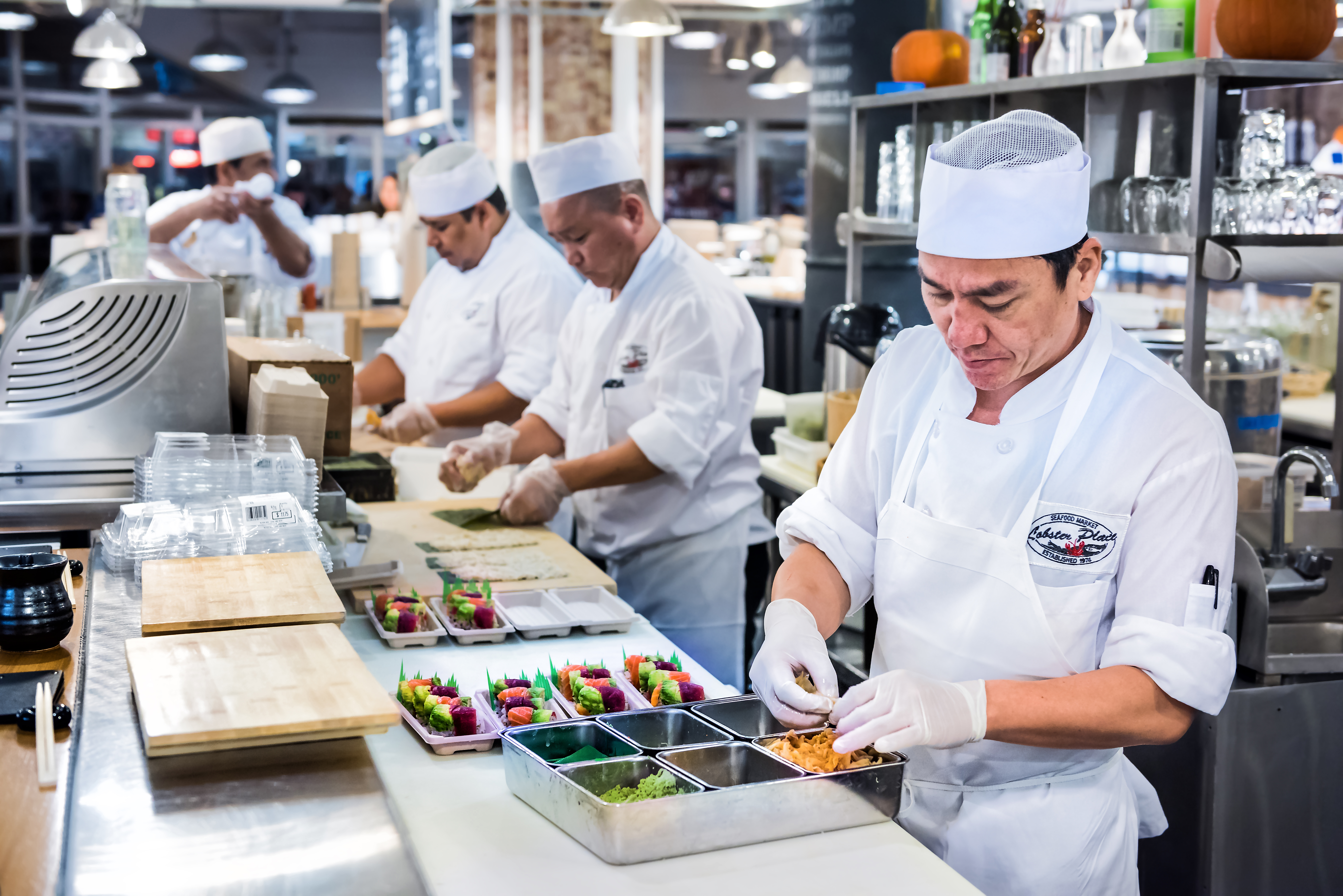 chefs preparing food in a restaurant